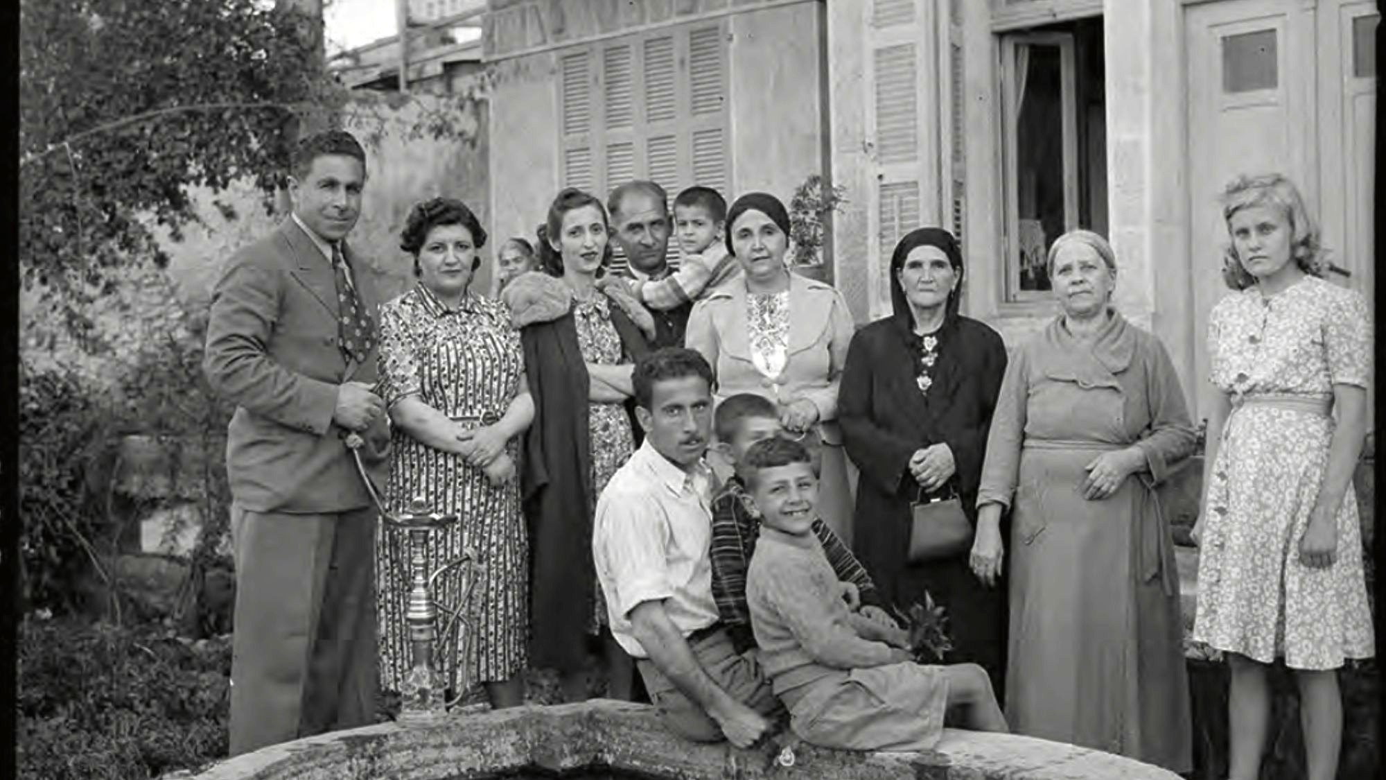 Acre State Stallion Farm staff in the garden of Jamil Pasha’s house in Haifa, April 23, 1940 (MEE/Haymarket Books)